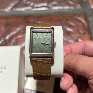 Breda mens watch. Face is olive green. Brown “crocodile” band.